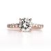 4 Prong Solitaire Setting With Micro Pavé Diamonds Around The Basket & 3/4 Way Along The Band in Rose Gold